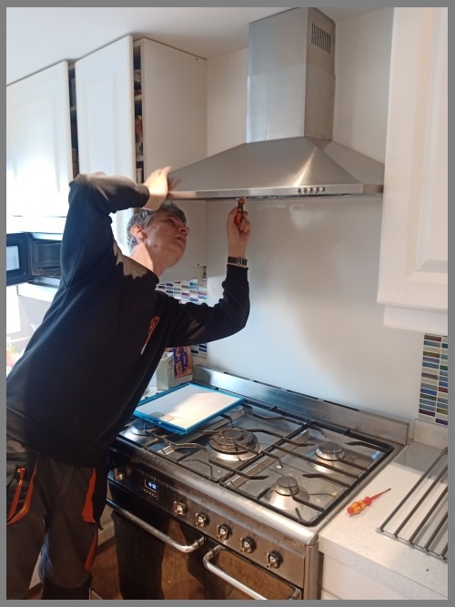 Kitchen hood installer in Leicester preparing commercial extraction canopy